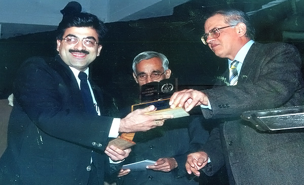 CEO receiving award from CBSE chairman